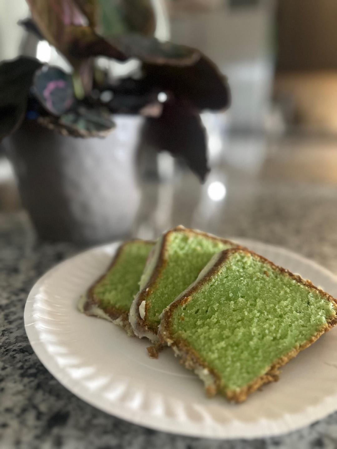Slices of green pound cake on a plate