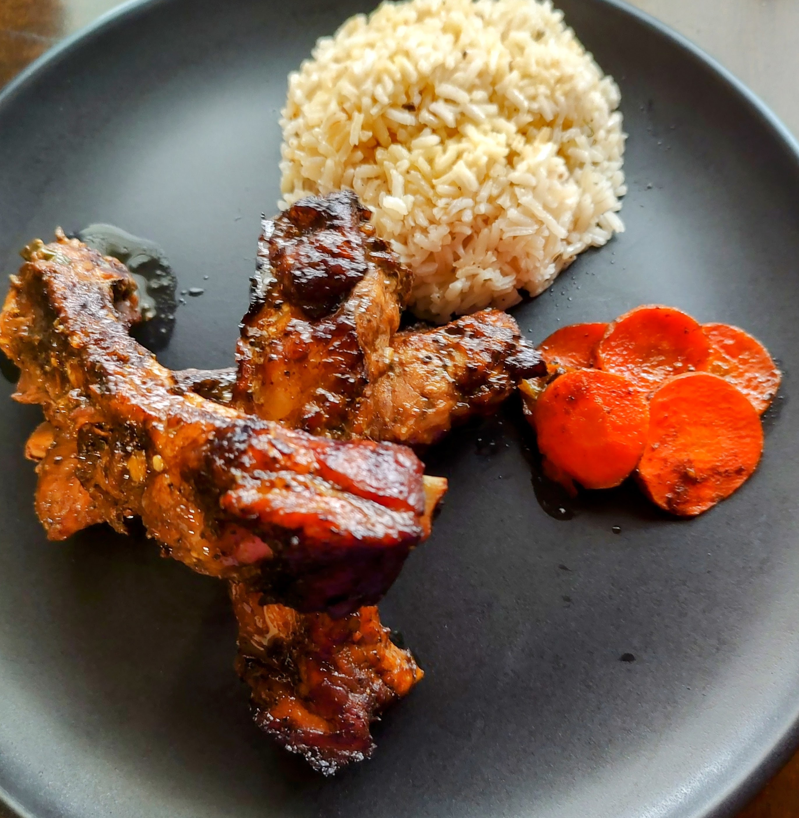 Glazed ribs with rice and roasted carrots